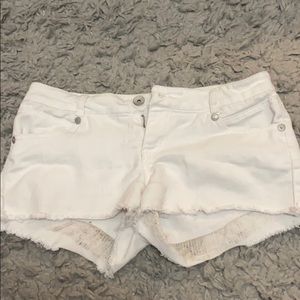 White ripped jean shorts
